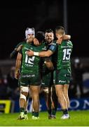 1 January 2022; Connacht players, from left, Mack Hansen, Bundee Aki, 12, Conor Oliver and Tiernan O’Halloran celebrate at the final whistle after the United Rugby Championship match between Connacht and Munster at The Sportsground in Galway. Photo by Brendan Moran/Sportsfile