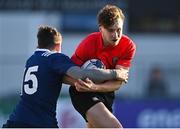 4 January 2022; Karl Hartfiel of North East is tackled by James Harris of North Midlands during the Bank of Ireland Leinster Rugby Shane Horgan Cup Round 4 match between North East and North Midlands at Energia Park in Dublin. Photo by Piaras Ó Mídheach/Sportsfile