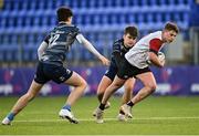4 January 2022; Sam Mills of Midlands in action against Gavin Keane, left, and Will Saunders of Metro during the Bank of Ireland Leinster Rugby Shane Horgan Cup Round 4 match between Metro and Midlands at Energia Park in Dublin. Photo by Piaras Ó Mídheach/Sportsfile