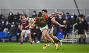 7 January 2022; Padraig O’Hora of Mayo is tackled by Damien Comer of Galway during the Connacht FBD League semi-final match between Mayo and Galway at the NUI Galway Connacht GAA Air Dome in Bekan, Mayo. Photo by Eóin Noonan/Sportsfile