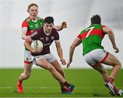 7 January 2022; Cormac McWalter of Galway is tackled by Paddy Heneghan of Mayo during the Connacht FBD League semi-final match between Mayo and Galway at the NUI Galway Connacht GAA Air Dome in Bekan, Mayo. Photo by Eóin Noonan/Sportsfile