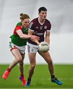 7 January 2022; Cormac McWalter of Galway is tackled by Paddy Heneghan of Mayo during the Connacht FBD League semi-final match between Mayo and Galway at the NUI Galway Connacht GAA Air Dome in Bekan, Mayo. Photo by Eóin Noonan/Sportsfile
