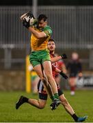 7 January 2022; Ciaran Thompson of Donegal in action against Anthony Doherty of Down during the Dr McKenna Cup Round 1 match between Donegal and Down at Pairc MacCumhaill in Ballybofey, Donegal. Photo by Ramsey Cardy/Sportsfile