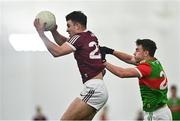 7 January 2022; Tomo Culhane of Galway in action against Ruairi Keane of Mayo during the Connacht FBD League semi-final match between Mayo and Galway at the NUI Galway Connacht GAA Air Dome in Bekan, Mayo. Photo by Eóin Noonan/Sportsfile