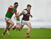 7 January 2022; Liam Costello of Galway in action against Matthew Ruane of Mayo during the Connacht FBD League semi-final match between Mayo and Galway at the NUI Galway Connacht GAA Air Dome in Bekan, Mayo. Photo by Eóin Noonan/Sportsfile