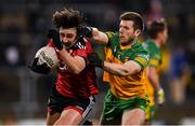 7 January 2022; Josh Connery of Down is tackled by Eoghan Ban Gallagher of Donegal during the Dr McKenna Cup Round 1 match between Donegal and Down at Pairc MacCumhaill in Ballybofey, Donegal. Photo by Ramsey Cardy/Sportsfile