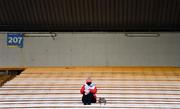8 January 2022; A supporter takes her seat before the 2020 AIB All-Ireland Intermediate Club Camogie Championship Final match between Gailltír and St Rynagh's at Semple Stadium in Thurles, Tipperary. Photo by Ben McShane/Sportsfile