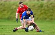 8 January 2022; Joseph Hagan of Longford in action against Niall Sharkey of Louth during the O'Byrne Cup group A match between Longford and Louth at Rathcline GAA club in Lanesboro, Longford. Photo by Ramsey Cardy/Sportsfile