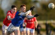 8 January 2022; Ryan Moffett of Longford in action against Conall McCaul of Louth during the O'Byrne Cup group A match between Longford and Louth at Rathcline GAA club in Lanesboro, Longford. Photo by Ramsey Cardy/Sportsfile
