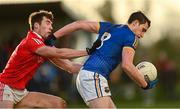 8 January 2022; Darren Gallagher of Longford is tackled by Jack Murphy of Louth during the O'Byrne Cup group A match between Longford and Louth at Rathcline GAA club in Lanesboro, Longford. Photo by Ramsey Cardy/Sportsfile