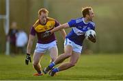 8 January 2022; Gareth Dillon of Laois in action against Alan Tobin of Wexford during the O'Byrne Cup group B match between Wexford and Laois at Hollymount in Galbally, Wexford. Photo by Seb Daly/Sportsfile