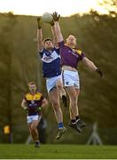 8 January 2022; Brian Daly of Laois in action against Darragh Lyons of Wexford during the O'Byrne Cup group B match between Wexford and Laois at Hollymount in Galbally, Wexford. Photo by Seb Daly/Sportsfile