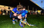 8 January 2022; Helen Dolan of St Rynagh's and her daughter Liadán, age 1, celebrate with the cup after the 2020 AIB All-Ireland Intermediate Club Camogie Championship Final match between Gailltír and St Rynagh's at Semple Stadium in Thurles, Tipperary. Photo by Ben McShane/Sportsfile