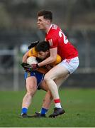 8 January 2022; Ronan Lanigan of Clare in action against David Buckley of Cork during the McGrath Cup group A match between Clare and Cork at Hennessy Memorial Park in Miltown Malbay, Clare. Photo by Stephen McCarthy/Sportsfile