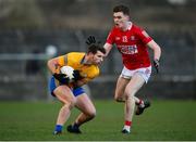 8 January 2022; Ronan Lanigan of Clare in action against David Buckley of Cork during the McGrath Cup group A match between Clare and Cork at Hennessy Memorial Park in Miltown Malbay, Clare. Photo by Stephen McCarthy/Sportsfile