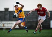 8 January 2022; Dan Keating of Clare in action against Diarmuid Phelan of Cork during the McGrath Cup group A match between Clare and Cork at Hennessy Memorial Park in Miltown Malbay, Clare. Photo by Stephen McCarthy/Sportsfile
