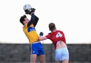 8 January 2022; Mark McInerney of Clare in action against Paul Ring of Cork during the McGrath Cup group A match between Clare and Cork at Hennessy Memorial Park in Miltown Malbay, Clare. Photo by Stephen McCarthy/Sportsfile