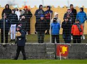 8 January 2022; Spectators, including broadcasters Marty Morrissey, right, and Tony O'Donoghue, second from right, watch on during the McGrath Cup group A match between Clare and Cork at Hennessy Memorial Park in Miltown Malbay, Clare. Photo by Stephen McCarthy/Sportsfile