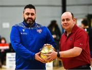 8 January 2022; Basketball Ireland President PJ Reidy, right, presents UCC Demons head coach Daniel O'Mahony with the Coach of the Month  Award for December before the President's Cup semi-final match between UCC Demons and EJ Sligo All-Stars at Parochial Hall in Cork. Photo by Sam Barnes/Sportsfile