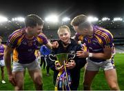 8 January 2022; Kilmacud Crokes supporter Connell Gallagher celebrates with players, Dara Mullin, left, and Shane Cunningham after the AIB Leinster GAA Football Senior Club Championship Final match between Kilmacud Crokes and Naas at Croke Park in Dublin. Photo by David Fitzgerald/Sportsfile