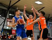 8 January 2022; Tobias Christensen of UCC Demons in action against Eoghan Donaghy, right, and Cian Lally of EJ Sligo All-Stars during the President's Cup semi-final match between UCC Demons and EJ Sligo All-Stars at Parochial Hall in Cork. Photo by Sam Barnes/Sportsfile