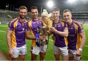 8 January 2022; Kilmacud Crokes players, left to right, Shane Horan, Craig Dias, Craig's daughter Lola, Dara Mullin, and Shane Cunningham celebrate after the AIB Leinster GAA Football Senior Club Championship Final match between Kilmacud Crokes and Naas at Croke Park in Dublin. Photo by Daire Brennan/Sportsfile