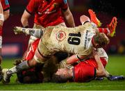 8 January 2022; Shane Daly of Munster is tackled by Kieran Treadwell of Ulster which resulted in a yellow card for the Ulster player during the United Rugby Championship match between Munster and Ulster at Thomond Park in Limerick. Photo by Stephen McCarthy/Sportsfile