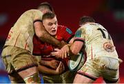 8 January 2022; Gavin Coombes of Munster is tackled by Alan O’Connor, left, and Andrew Warwick of Ulster during the United Rugby Championship match between Munster and Ulster at Thomond Park in Limerick. Photo by Stephen McCarthy/Sportsfile