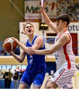 9 January 2022; Jack O'Leary of UCC Demons in action against Sam O'Regan of Ballincollig BC during the Basketball Ireland Men's U20 Cup semi-final match between UCC Blue Demons and Ballincollig BC at Neptune Stadium in Cork. Photo by Brendan Moran/Sportsfile