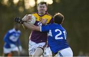 8 January 2022; Tom Byrne of Wexford in action against Gareth Dillon of Laois during the O'Byrne Cup group B match between Wexford and Laois at Hollymount in Galbally, Wexford. Photo by Seb Daly/Sportsfile