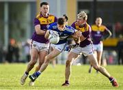 8 January 2022; Trevor Collins of Laois in action against Eoghan Nolan, left, and Tom Byrne of Wexford during the O'Byrne Cup group B match between Wexford and Laois at Hollymount in Galbally, Wexford. Photo by Seb Daly/Sportsfile