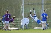 8 January 2022; Ben Brosnan of Wexford shoots to score his side's second goal, past Laois goalkeeper Niall Corbet, during the O'Byrne Cup group B match between Wexford and Laois at Hollymount in Galbally, Wexford. Photo by Seb Daly/Sportsfile