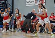 9 January 2022; Singleton SuperValu Brunell head coach Micheal Hennessy and Singleton SuperValu Brunell players celebrate a late basket at the end of the second quarter during the Basketball Ireland Women's U20 semi-final match between Singleton Supervalu Brunell and Portlaoise Panthers at Parochial Hall in Cork. Photo by Sam Barnes/Sportsfile