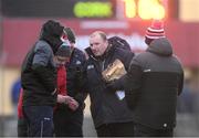 8 January 2022; Cork manager Keith Ricken speaks to members of his backroom team at half-time of the McGrath Cup group A match between Clare and Cork at Hennessy Memorial Park in Miltown Malbay, Clare. Photo by Stephen McCarthy/Sportsfile