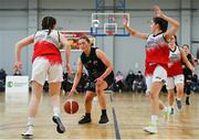 9 January 2022; Gillian Wheeler of Portlaoise Panthers in action against Issy McSweeney, left, and Mia Finnegan of Singleton SuperValu Brunell during the Basketball Ireland Women's U20 semi-final match between Singleton Supervalu Brunell and Portlaoise Panthers at Parochial Hall in Cork. Photo by Sam Barnes/Sportsfile