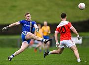 9 January 2022; Knockmore goalkeeper Colm Reape scores a point from play, as Lorcán Daly of Pádraig Pearses close in, during the AIB Connacht GAA Football Senior Club Championship Final match between Knockmore and Pádraig Pearses at James Stephens Park in Ballina, Mayo. Photo by Piaras Ó Mídheach/Sportsfile