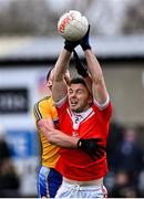 9 January 2022; Mark Richardson of Pádraig Pearses is tackled by James Ruddy of Knockmore during the AIB Connacht GAA Football Senior Club Championship Final match between Knockmore and Pádraig Pearses at James Stephens Park in Ballina, Mayo. Photo by Piaras Ó Mídheach/Sportsfile