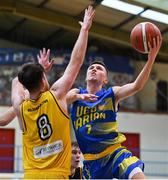 9 January 2022; Conor Walsh of UCD Marian in action against Callum Russell of Killorglin CYMS during the Basketball Ireland Men's U20 Cup semi-final match between UCD Marian and Killorglin CYMS at Neptune Stadium in Cork. Photo by Brendan Moran/Sportsfile