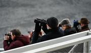 9 January 2022; Racegoers watch through binoculars during the Irish Stallion Farms EBF Rated Novice Steeplechase at Fairyhouse Racecourse in Ratoath, Meath. Photo by Seb Daly/Sportsfile