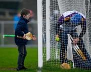 9 January 2022; Wexford supporter Jerry Connors, age 9, from Gorey, gets the match sliotar from Wexford goalkeeper Mark Fanning after the Walsh Cup Senior Hurling round 1 match between Laois and Wexford at Kelly Daly Park in Rathdowney, Laois. Photo by David Fitzgerald/Sportsfile