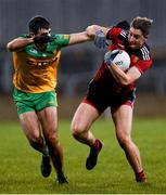 7 January 2022; Cormac O'Rawe of Down is tackled by Caolan McGonigle of Donegal during the Dr McKenna Cup Round 1 match between Donegal and Down at Pairc MacCumhaill in Ballybofey, Donegal. Photo by Ramsey Cardy/Sportsfile