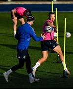 11 January 2022; Adam Byrne offloads to Jonathan Sexton during a Leinster rugby squad training session at Energia Park in Dublin. Photo by Harry Murphy/Sportsfile