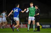 5 January 2022; Team captains David Clifford of Kerry, left, and Donal O’Sullivan of Limerick fist bump, in the company of referee John Ryan before the McGrath Cup Group B match between Kerry and Limerick at Austin Stack Park in Tralee, Kerry. Photo by Brendan Moran/Sportsfile