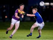 12 January 2022; Colum Feeny of Wexford in action against Craig Maguire of Wicklow during the O'Byrne Cup Group B match between Wicklow and Wexford at Bray Emmets GAA Club in Bray, Wicklow. Photo by Harry Murphy/Sportsfile