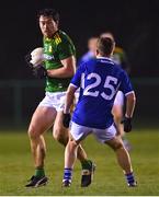 12 January 2022; Padraic Harnan of Meath in action against Ross Munnelly of Laois during the O'Byrne Cup Group B match between Laois and Meath at Stradbally GAA Club in Stradbally, Laois. Photo by Piaras Ó Mídheach/Sportsfile