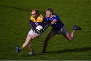 12 January 2022; Kevin O'Grady of Wexford in action against Zach Cullen of Wicklow during the O'Byrne Cup Group B match between Wicklow and Wexford at Bray Emmets GAA Club in Bray, Wicklow. Photo by Harry Murphy/Sportsfile