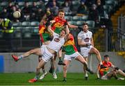 13 January 2022; Daniel Flynn of Kildare contests a high ball against Liam Brennan and Keegan Bradley of Carlow during the O'Byrne Cup Group C match between Carlow and Kildare at Netwatch Cullen Park in Carlow. Photo by Eóin Noonan/Sportsfile