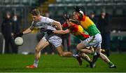 13 January 2022; Daniel Flynn of Kildare is tackled by Keegan Bradley and Conor Doyle of Carlow during the O'Byrne Cup Group C match between Carlow and Kildare at Netwatch Cullen Park in Carlow. Photo by Eóin Noonan/Sportsfile