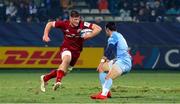 14 January 2022; Jack O’Donoghue of Munster in action against Thomas Larregain of Castres Olympique during the Heineken Champions Cup Pool B match between Castres Olympique and Munster at Stade Pierre Fabre in Castres, France. Photo by Manuel Blondeu/Sportsfile