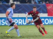 14 January 2022; Jack Crowley of Munster in action against Ryno Pieterse of Castres Olympique during the Heineken Champions Cup Pool B match between Castres Olympique and Munster at Stade Pierre Fabre in Castres, France. Photo by Manuel Blondeu/Sportsfile